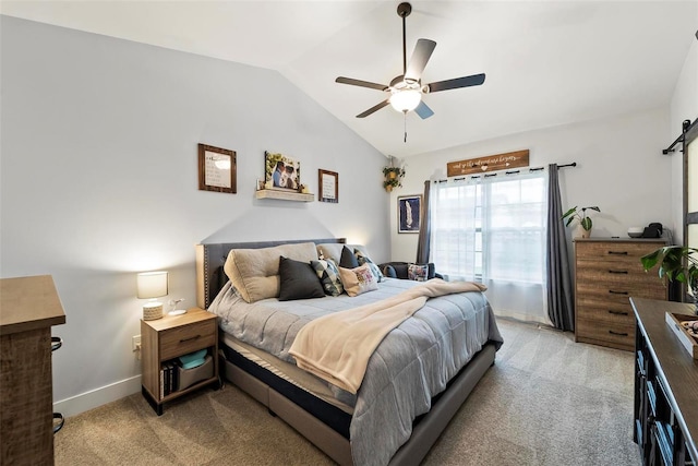 bedroom with a ceiling fan, baseboards, light carpet, and lofted ceiling