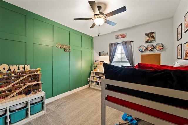 bedroom featuring light carpet and a ceiling fan