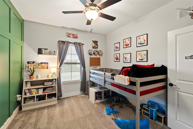 bedroom with baseboards, a ceiling fan, and carpet flooring