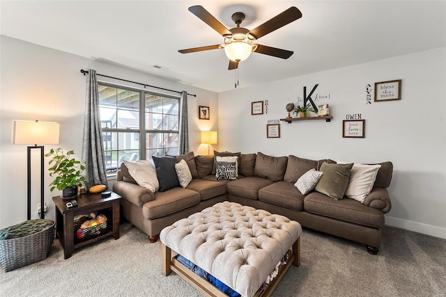 carpeted living room with ceiling fan, visible vents, and baseboards