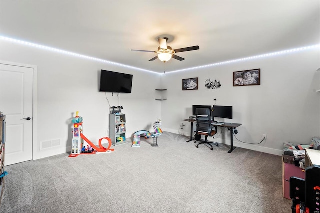 playroom with baseboards, ceiling fan, carpet flooring, and visible vents