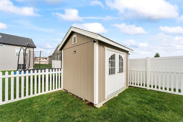 view of shed featuring a fenced backyard