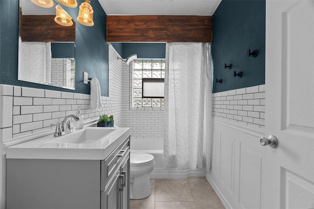 bathroom with tile patterned flooring, shower / tub combo, toilet, and vanity
