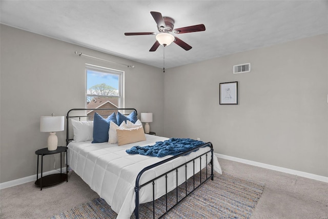 bedroom featuring baseboards, carpet flooring, and visible vents
