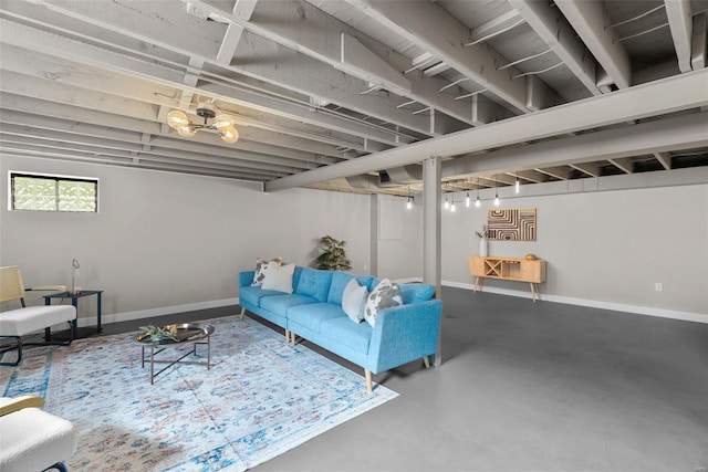 living area with finished concrete floors and baseboards