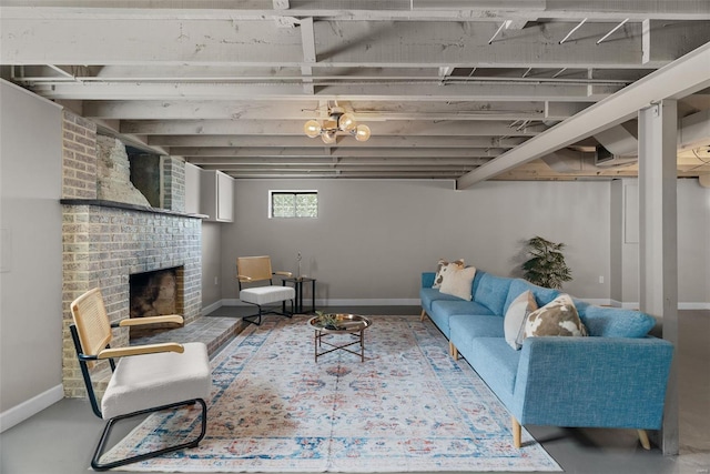 living area with baseboards and a brick fireplace