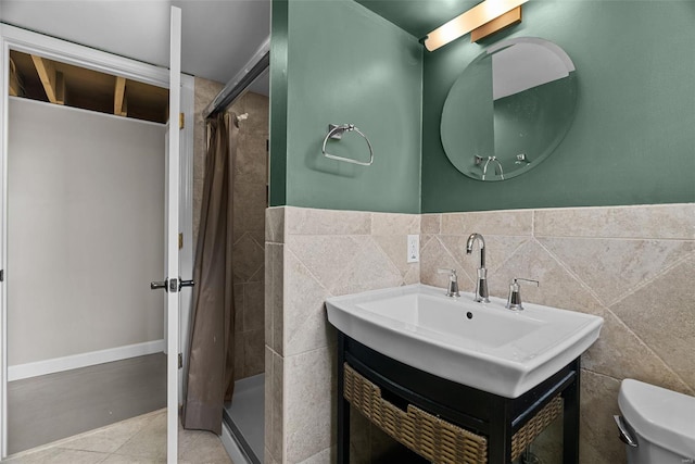 full bathroom with vanity, tile patterned flooring, a stall shower, and toilet