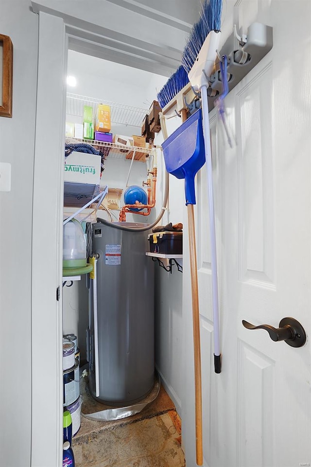 utility room with water heater