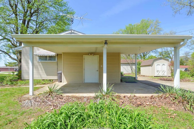 exterior space featuring an outdoor structure, a shed, and a carport