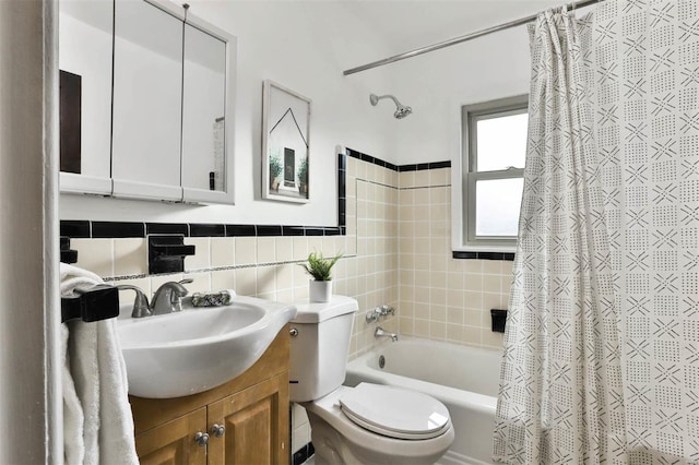 bathroom featuring decorative backsplash, tile walls, vanity, toilet, and shower / tub combo with curtain