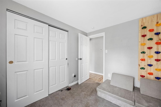 unfurnished room featuring carpet floors and baseboards