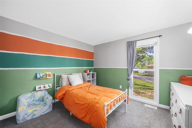 bedroom featuring carpet floors, baseboards, and visible vents