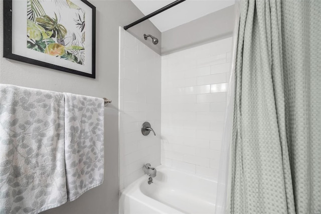 bathroom with shower / bathtub combination with curtain