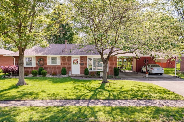 single story home with brick siding, a front yard, and concrete driveway