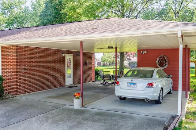 view of parking / parking lot with driveway and a carport