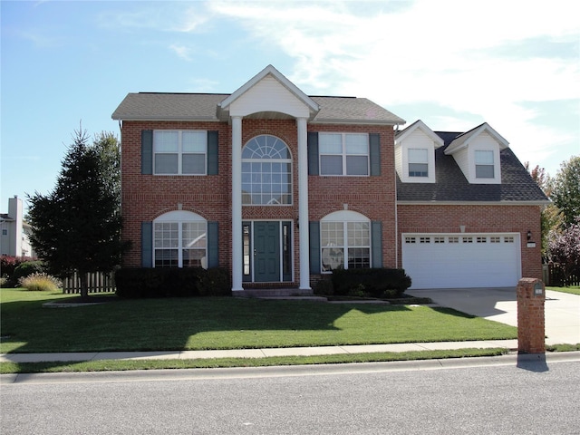 view of front of property featuring concrete driveway, brick siding, a garage, and a front lawn