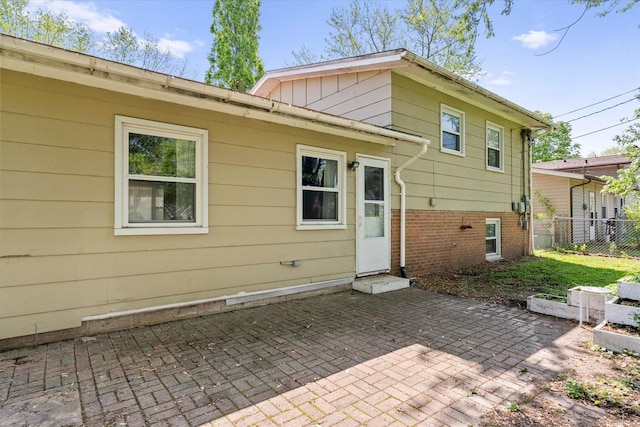 back of property with a patio and fence