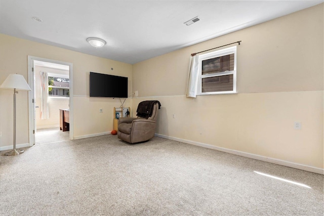 unfurnished room with baseboards, carpet, and visible vents