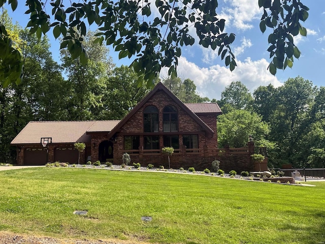 view of front of home featuring a garage, a front lawn, fence, and a tiled roof