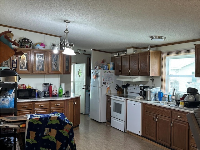kitchen with white appliances, a textured ceiling, under cabinet range hood, and light countertops
