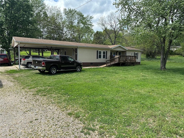 view of front of house featuring a wooden deck, a front yard, crawl space, a carport, and driveway