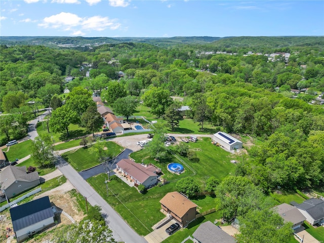 bird's eye view featuring a residential view and a forest view