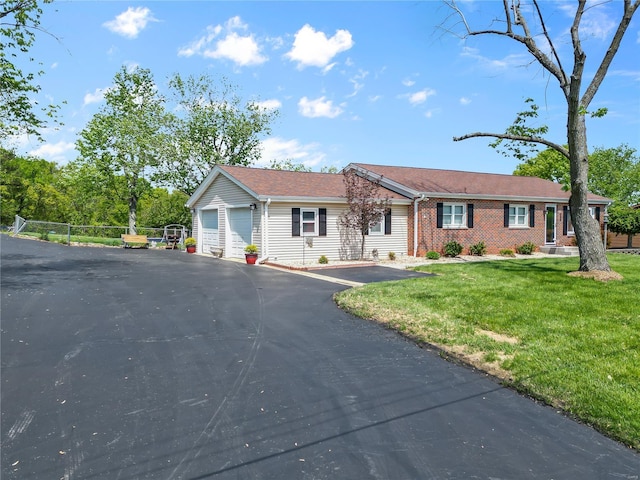 view of front of property featuring brick siding and a front yard