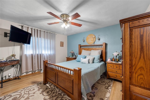 bedroom featuring a ceiling fan and light wood-style flooring