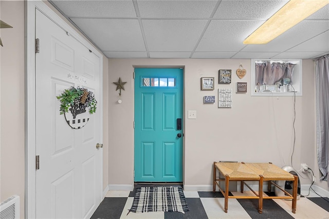 entrance foyer featuring visible vents, tile patterned floors, a paneled ceiling, and baseboards