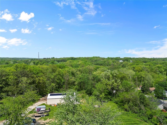 bird's eye view featuring a forest view