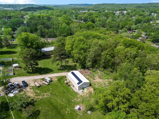 bird's eye view featuring a forest view