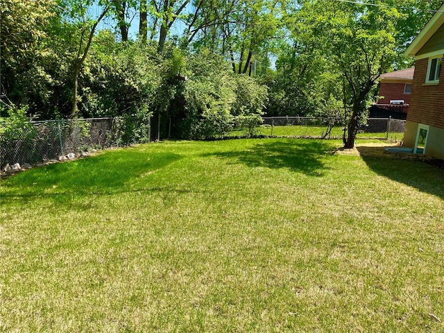 view of yard with a fenced backyard
