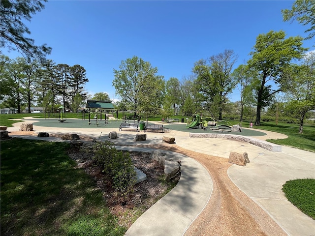 view of home's community with a yard and playground community