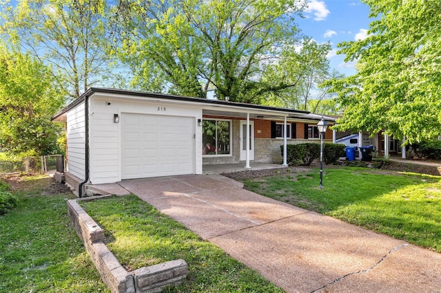 view of front of home featuring a garage, a front lawn, fence, covered porch, and concrete driveway