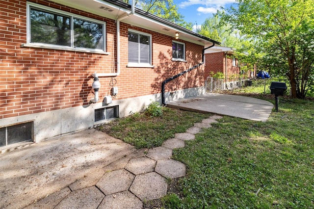 exterior space with brick siding