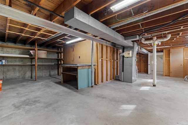 unfinished basement with heating unit