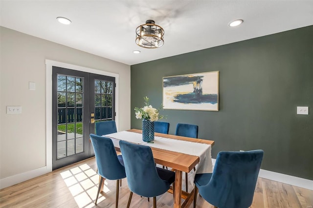 dining space with recessed lighting, baseboards, french doors, and light wood-style floors