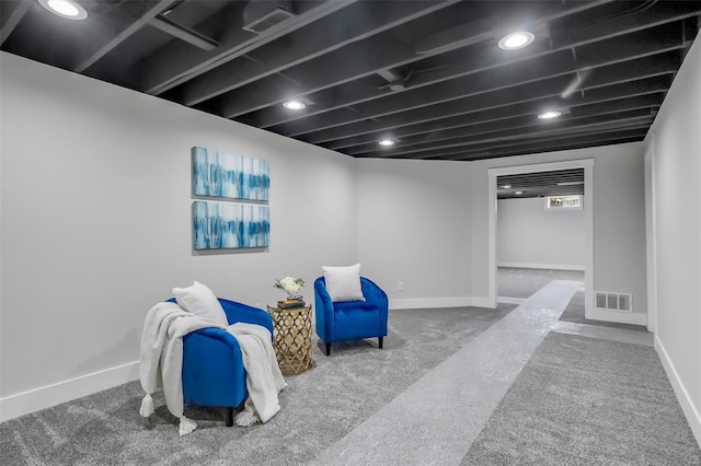 unfurnished room with baseboards, carpet flooring, and visible vents