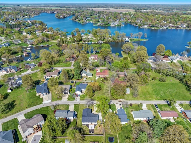 drone / aerial view featuring a water view and a residential view