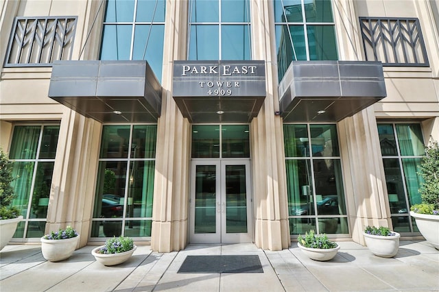 view of exterior entry featuring french doors