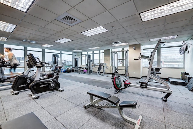 workout area featuring baseboards and visible vents