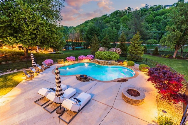 view of swimming pool with a patio, a fenced in pool, a fire pit, and a fenced backyard