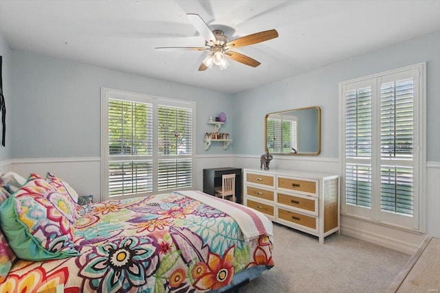 bedroom with ceiling fan and carpet