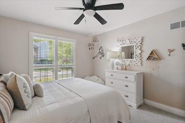 bedroom featuring light colored carpet, baseboards, visible vents, and ceiling fan
