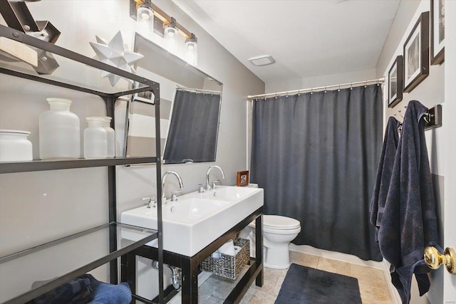 full bathroom with toilet, curtained shower, and vanity