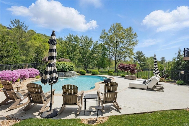 view of pool with a fenced backyard, a fenced in pool, and a patio area
