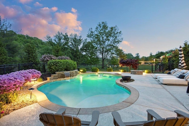 view of pool with a fenced in pool, a fenced backyard, and a patio area