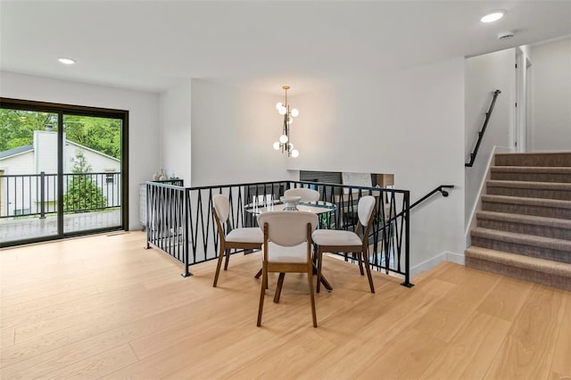 dining area featuring recessed lighting, baseboards, a chandelier, and light wood-type flooring
