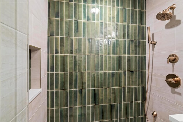 bathroom with tiled shower