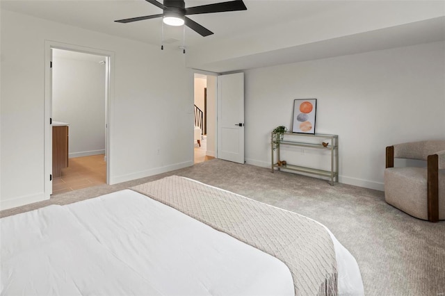 bedroom with baseboards, light carpet, and ceiling fan